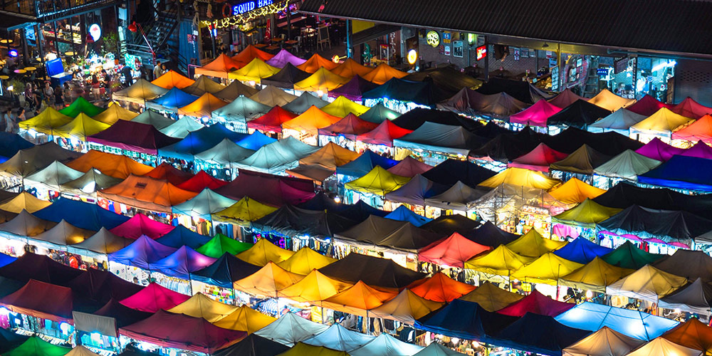outdoor market at night seen from above Photo by Sam Beasley on Unsplash